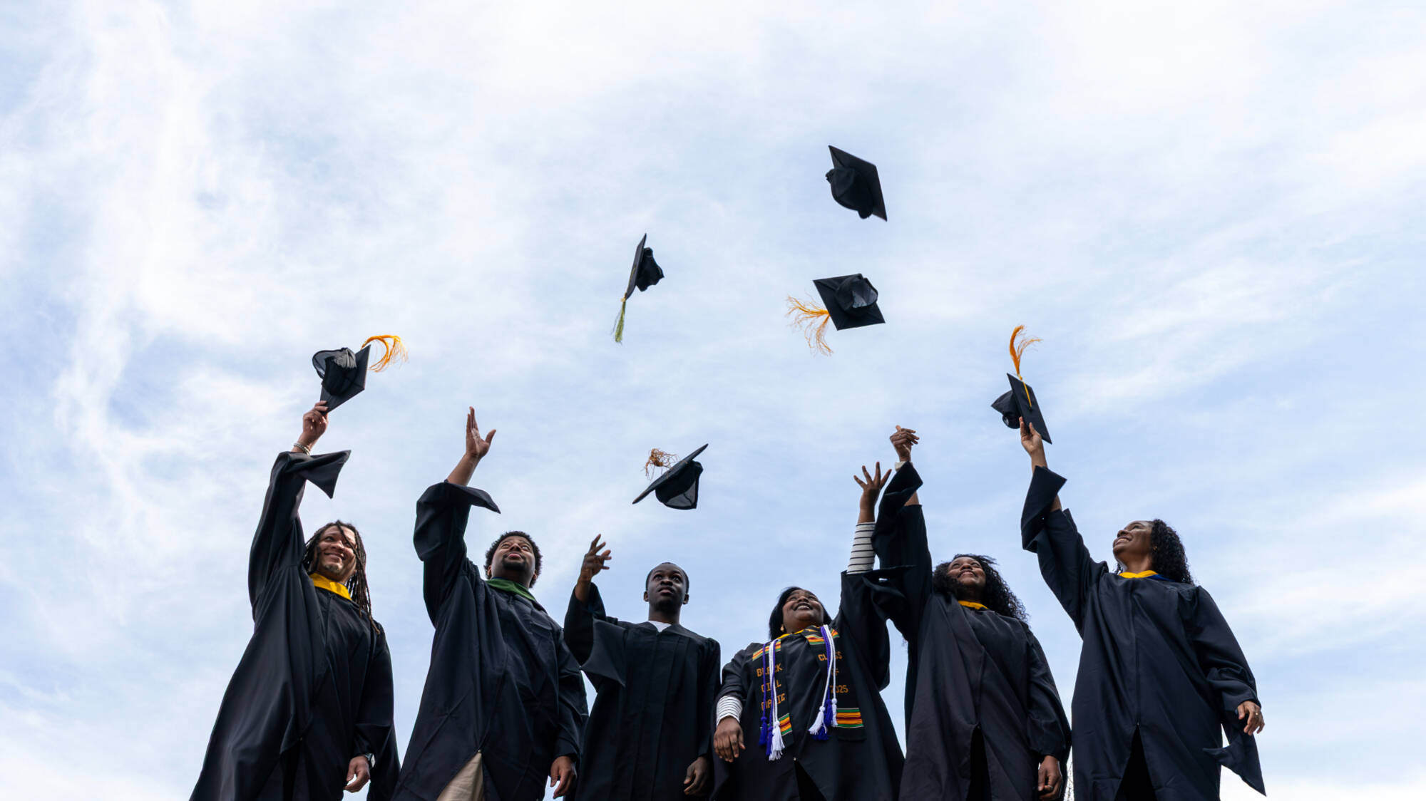 GVSU students from the HBCU consortium (from left) Quinton Randall, Kobe Rhynes, Jourdan Watson, Rashawny Alic, Darriel Wright and Skye Gerald, pose for a portrait outside the Mary Idema Pew Library on April 14.